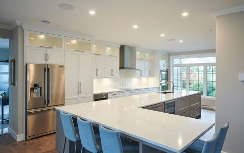 Photo of transitional style kitchen with white cabinets