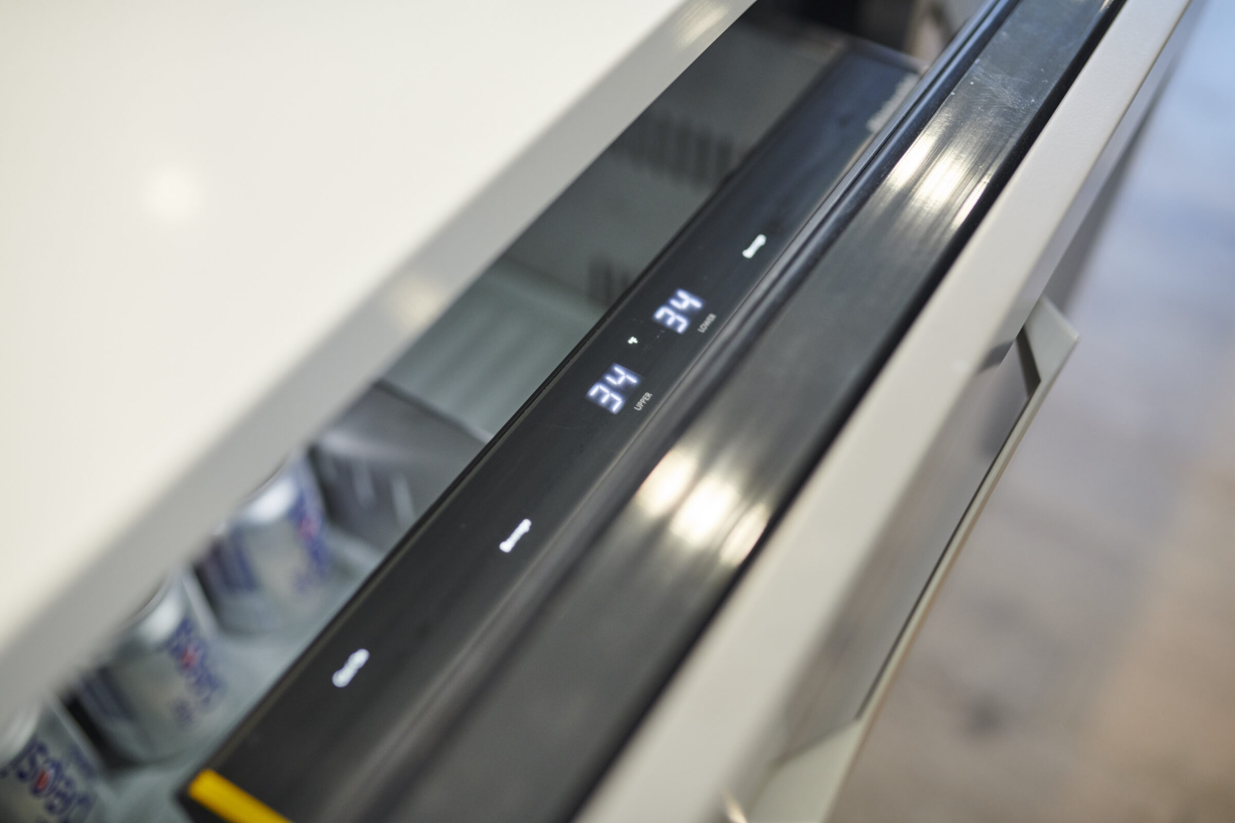 An angled, close-up view of a modern printer's output tray showing duplex printed pages with clear '3/4' page numbering visible.