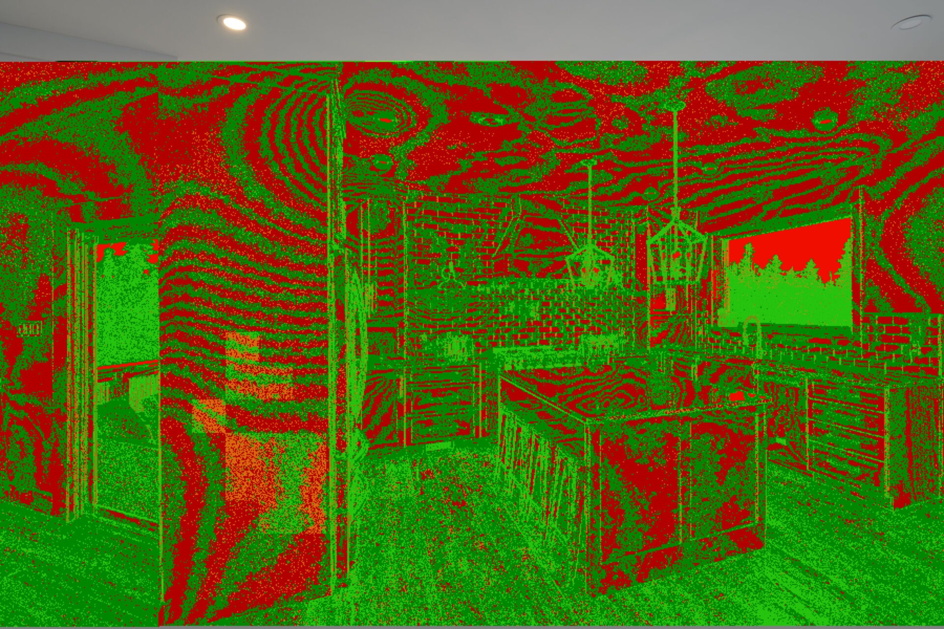 This image shows a room with distorted, vivid red and green colors creating a psychedelic or infrared-like visual effect on the interior setting.