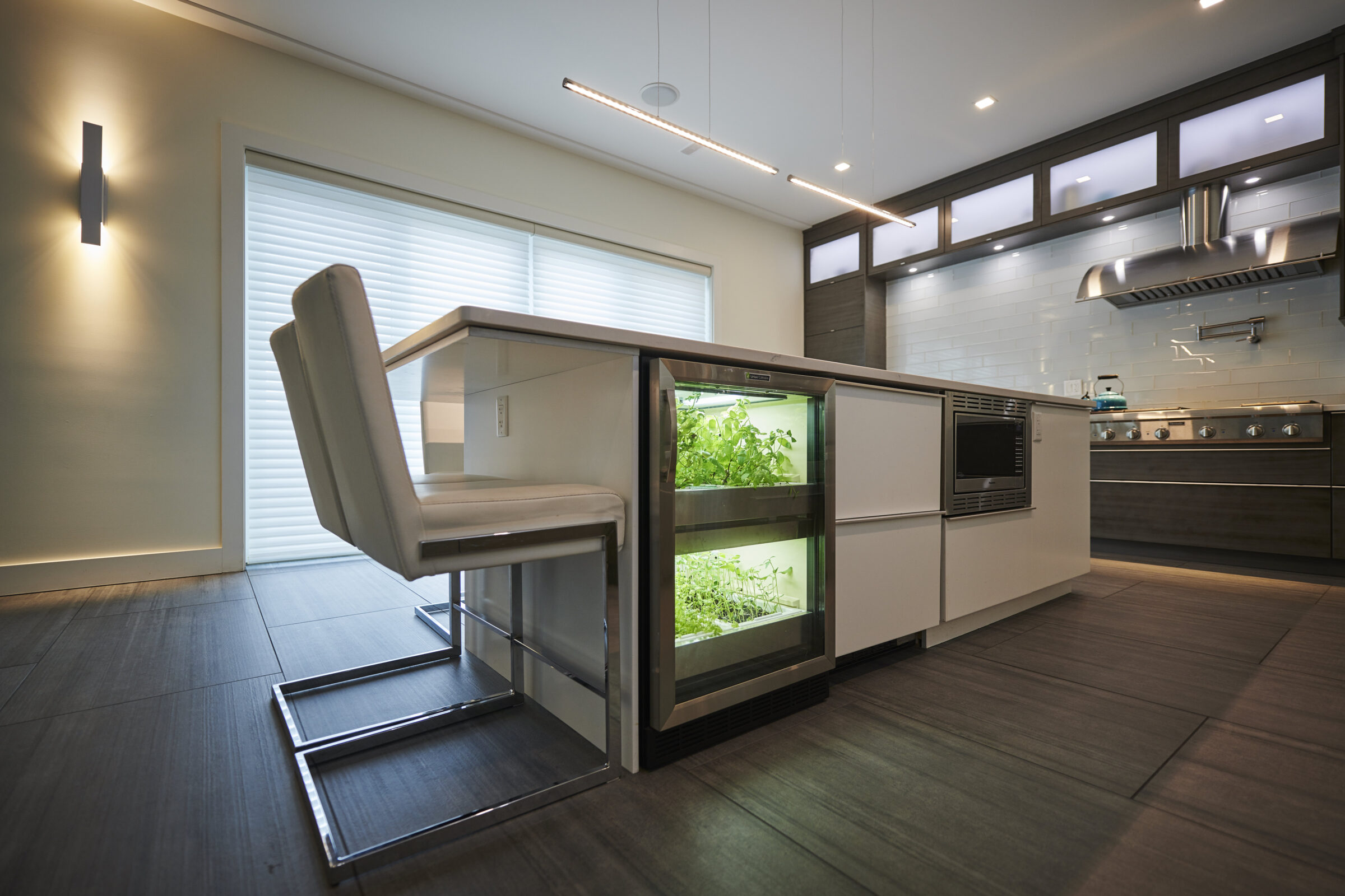 Kitchen cabinet trends using a built in herb garden in a custom modern kitchen.