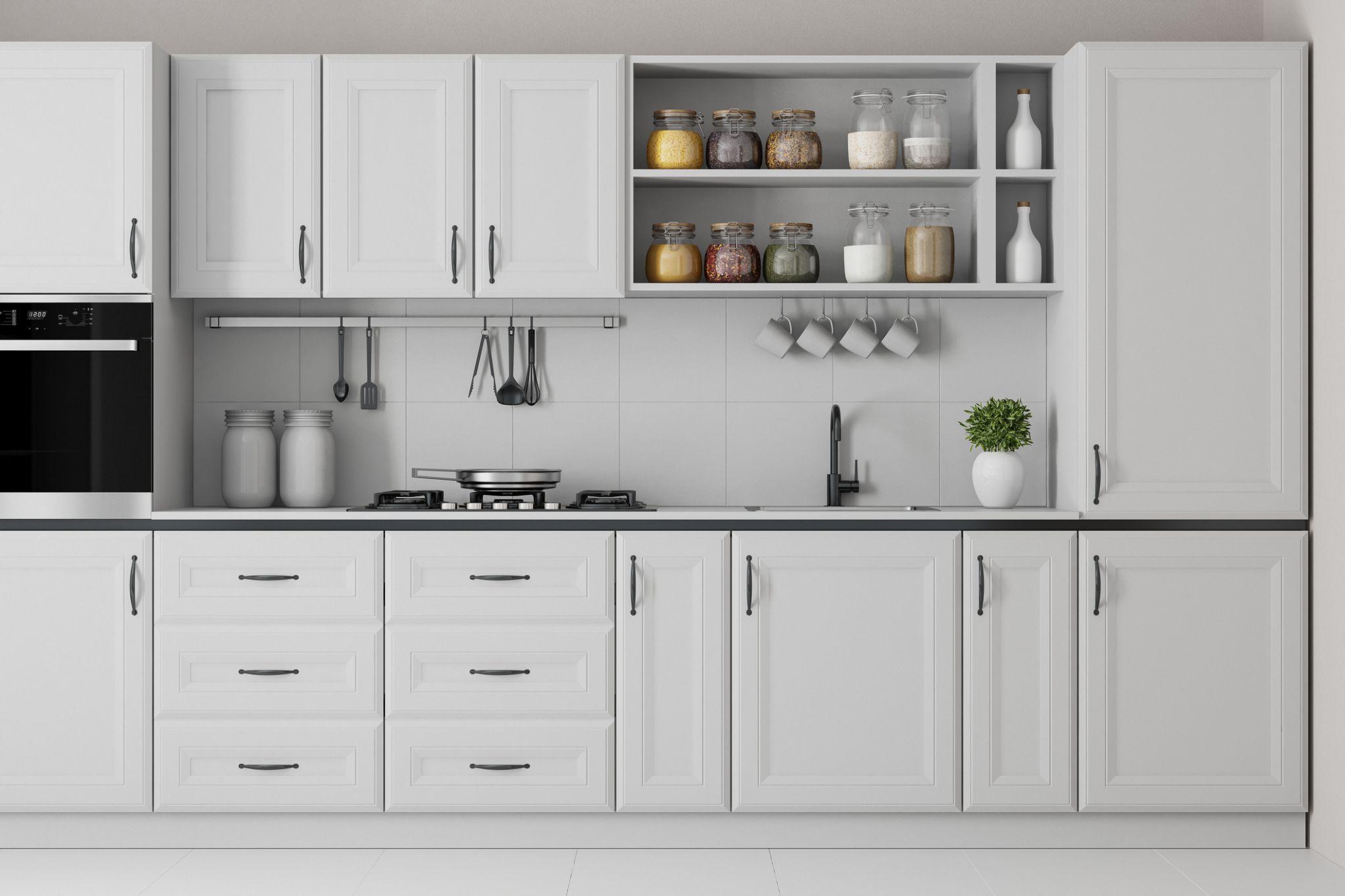 White shaker kitchen with open shelving, black hardware, and spice jar display